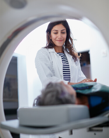radiologist talking to patient in mri machine