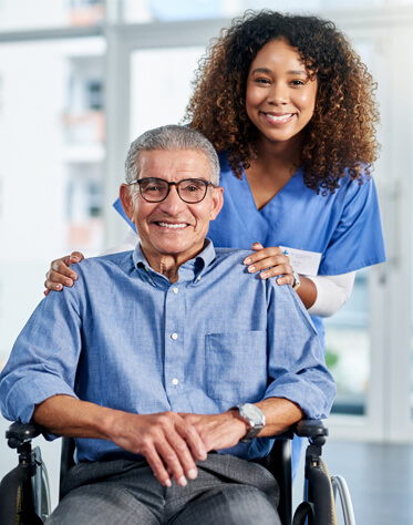 nurse next to patient in wheelchair