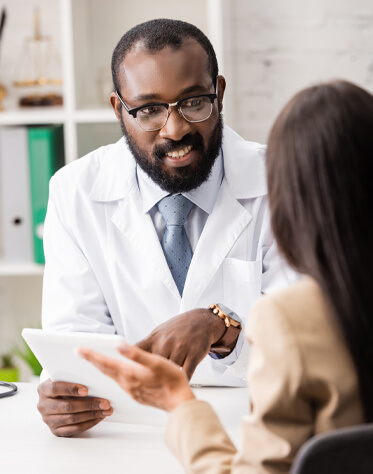 male doctor explaining a document to his patient 