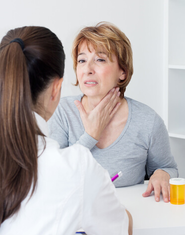 patient explaining her neck's pain